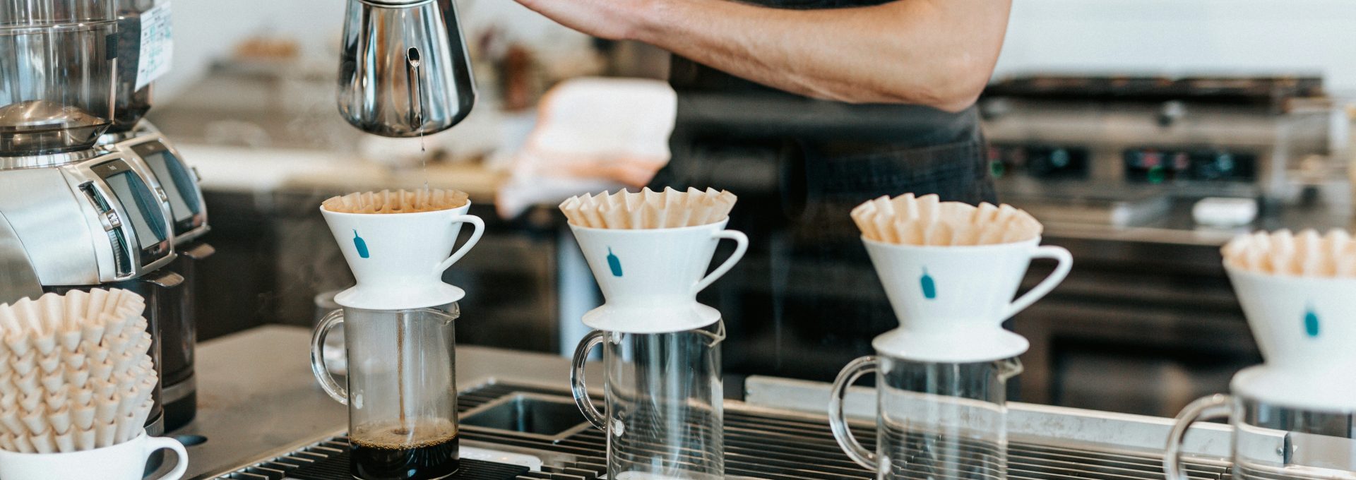 man pouring on cup