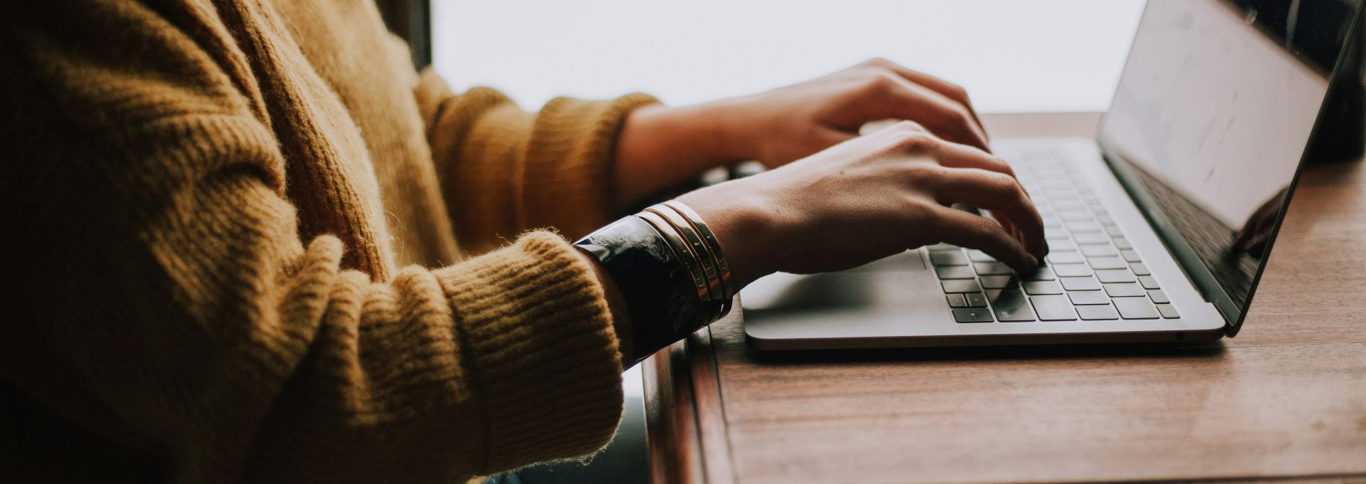 person sitting front of laptop